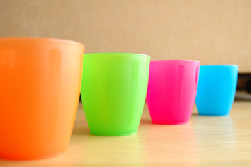 Colourful plastic mugs