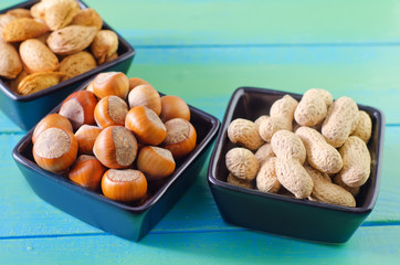 nuts in black bowls