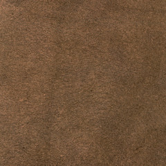 Fototapeta na wymiar Brown leather texture closeup