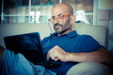 middle age man using notebook