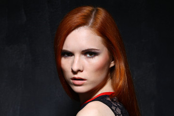 Fototapeta premium Young beautiful woman in studio