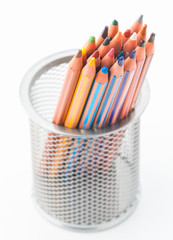 many pastel crayons, a bucket disordered