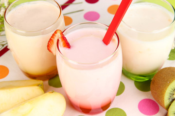 Delicious yogurts with fruits in glasses
