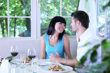 Beautiful young couple at restaurant