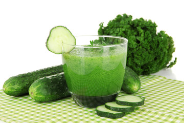Green vegetable juice on table on white background