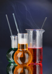 Laboratory glassware on dark color background