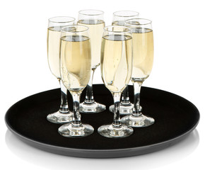 Many glasses of champagne on the tray, isolated on white