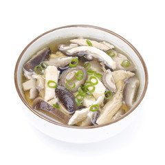 bowl of chinese soup with chicken, shiitake and green onion