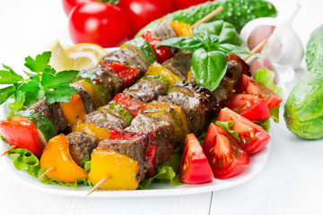 Grilled meat on skewers with vegetables