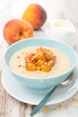 oatmeal with caramelized peaches in a bowl and yogurt