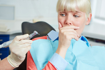 Woman at dental practice refusing treatment