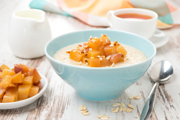 oatmeal with caramelized peaches, tea and yogurt