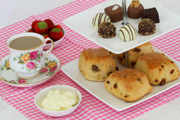 Cake tray with scones and chocolates