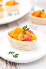 tartlet with roasted vegetables on a plate, close-up