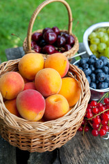 different berries on wooden table