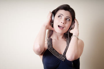 beautiful young woman listening to music