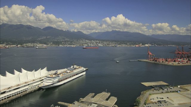 View of North Vancouver BC Canada with Water Transportation and Scenic View of Mountain Blue Sky and Moving Clouds 1920x1080