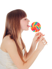Pretty Young girl licking a lollipop