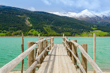 Weathered wooden pier at Alpine lake