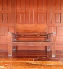 Obraz na płótnie Canvas wooden chair with wooden wall