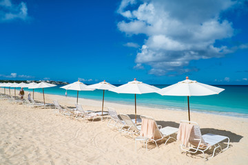Chairs and umbrellas on tropical beach