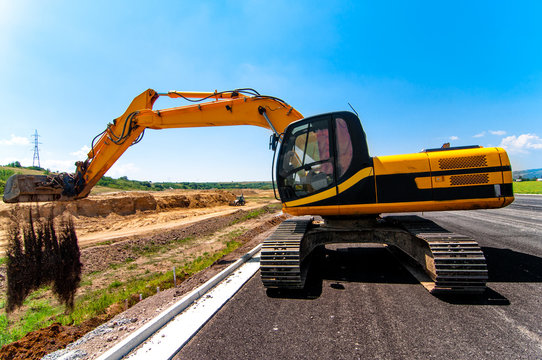 Excavator working on road construction site
