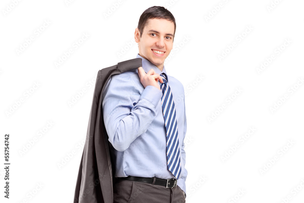 Wall mural young businessman walking with a coat over shoulder