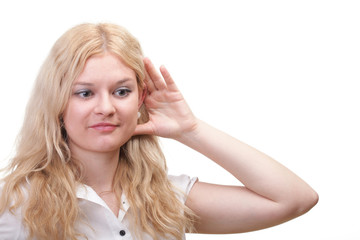 woman eavesdropping with hand behind her ear