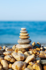 Stacked pebbles on the sea side