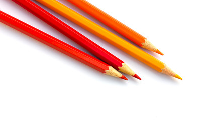 Colored pencils on white background.