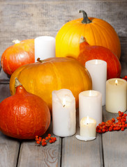 Halloween party decor. Beautiful orange pumpkins on wooden table