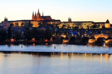 Prague gothic Castle with Charles Bridge after sunset