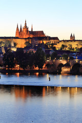 Prague gothic Castle above River Vltava after sunset