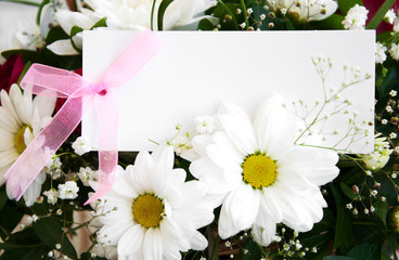 flowers with a white card