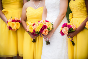 Bride Holding Bouquet with Bridesmaids in Background