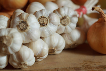 string of garlic on wood table