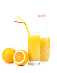 glass and a bottle of orange juice