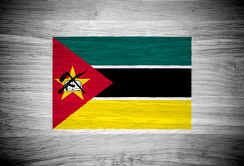 Mozambique flag on wood texture