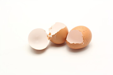 Pile of broken eggshell on white background
