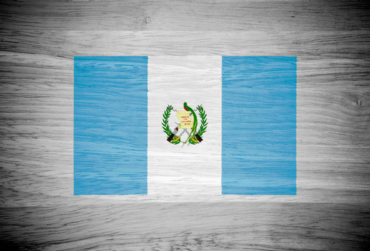 Guatemala flag on wood texture