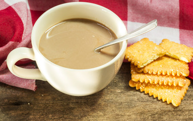 Coffee and cracker onwood table