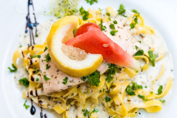 Fototapeta na wymiar tasty pasta with salmon