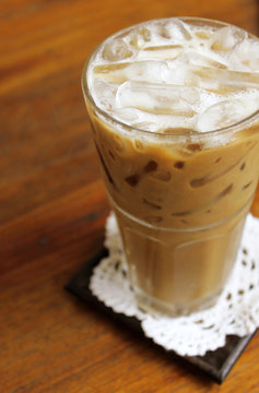 Iced coffee on wooden table