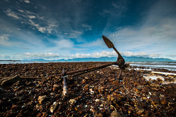 Anchor on a rocky beach