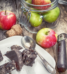 Pieces of dark chocolate and red delicious apples
