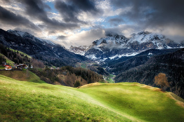 Obraz premium Cloudy sunrise over Dolomites mountains
