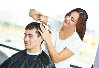 Male hairdresser at work