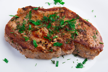 Grilled steak on white plate