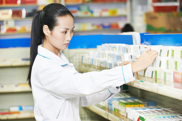 Chinese pharmacy chemist woman in china drugstore