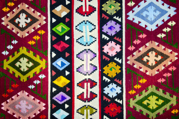 Old traditional romanian wool carpet with ancient motifs